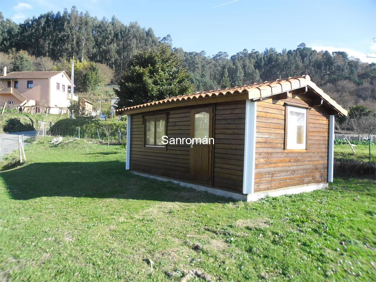 Terreno Edificable Con Casa Prefabricada De Madera En Tebra Tomino